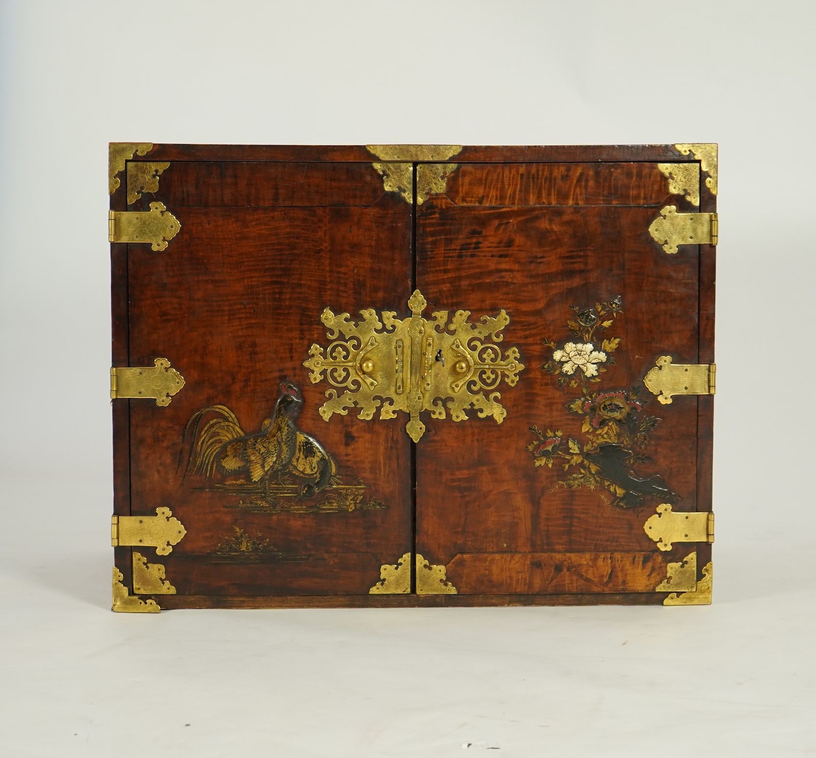 A Japanese mulberry wood, hiromaki-e lacquer and gilt copper mounted cabinet, c.1680-1700
